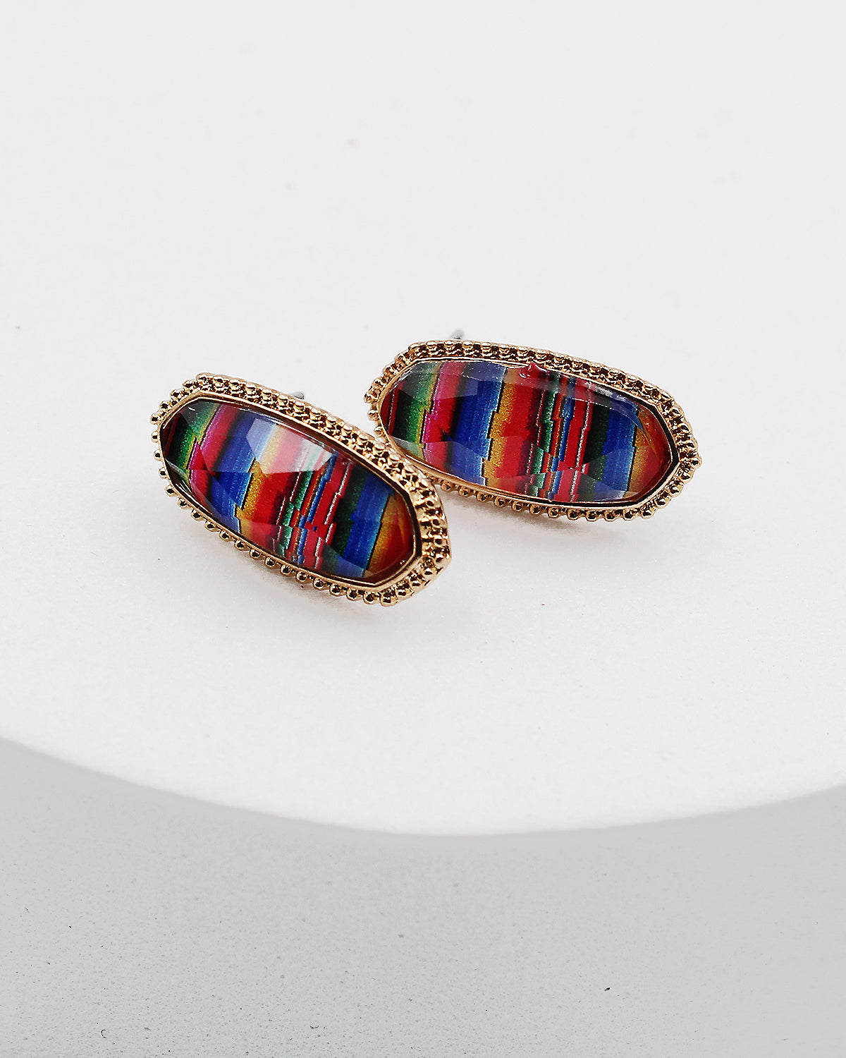 White serape selling earrings